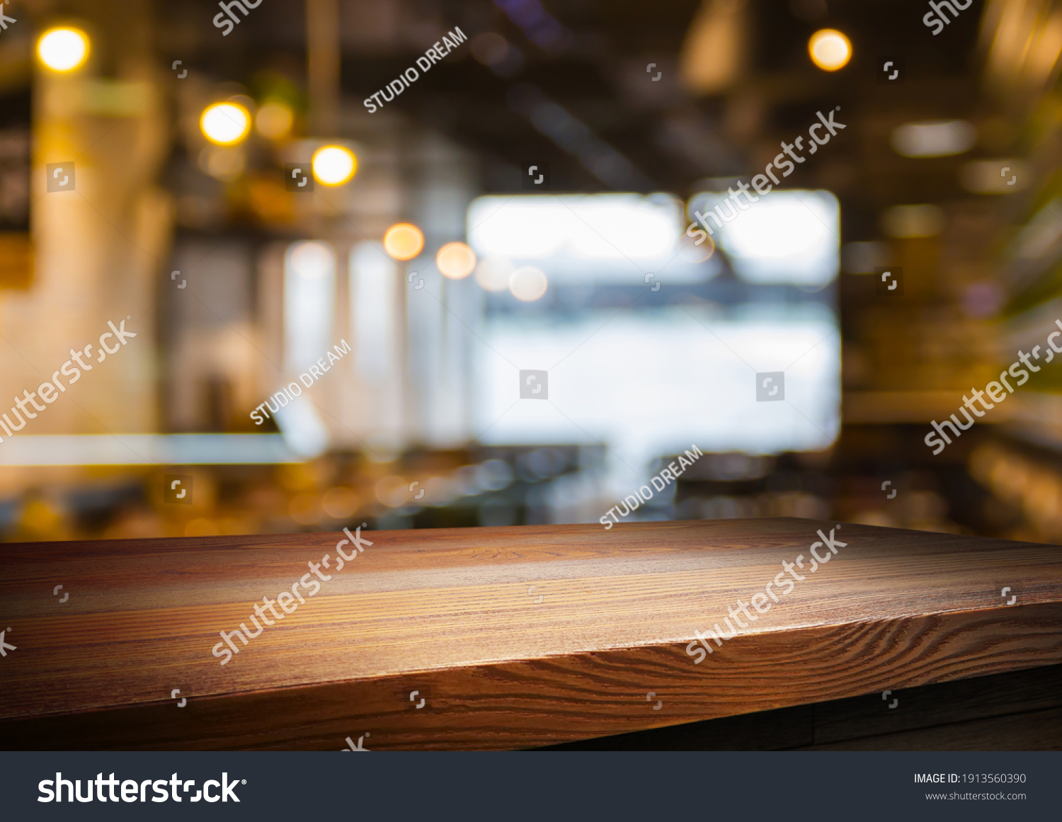 wooden table for placing products with a beautiful night restaurant backdrop, Space for placing items on the table, product and food display. #1913560390