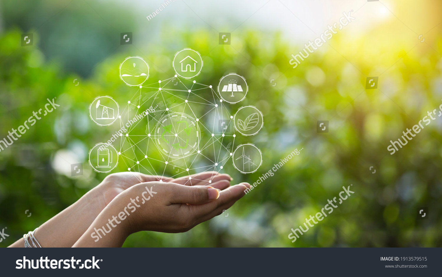 Technology, hand holding with environment Icons over the Network connection on green background. #1913579515