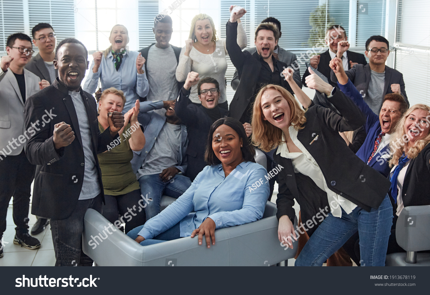 happy team of diverse corporate employees in the office lobby. #1913678119