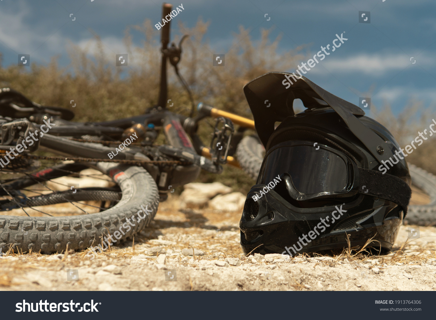 Professional MTB bike and helmet with a protective goggles for downhill cycling in mountains #1913764306