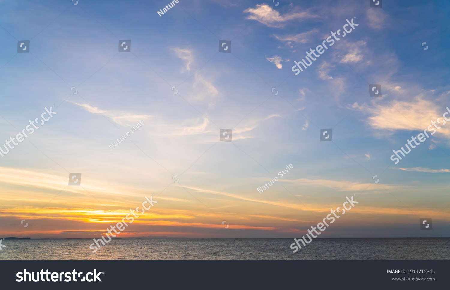 Sunset Horizon Sky over sea in the Evening with Romantic colorful Orange sunlight cloud, Dusk sky background  #1914715345