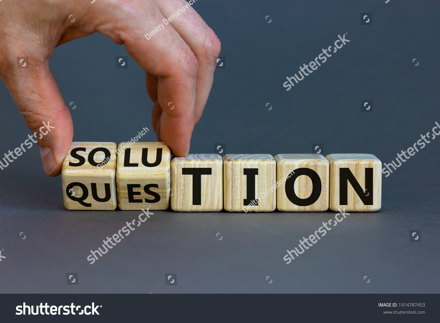 Question and solution symbol. Businessman turns wooden cubes and changes the word 'question' to 'solution'. Beautiful grey table, grey background, copy space. Business, question and solution concept. #1914787453