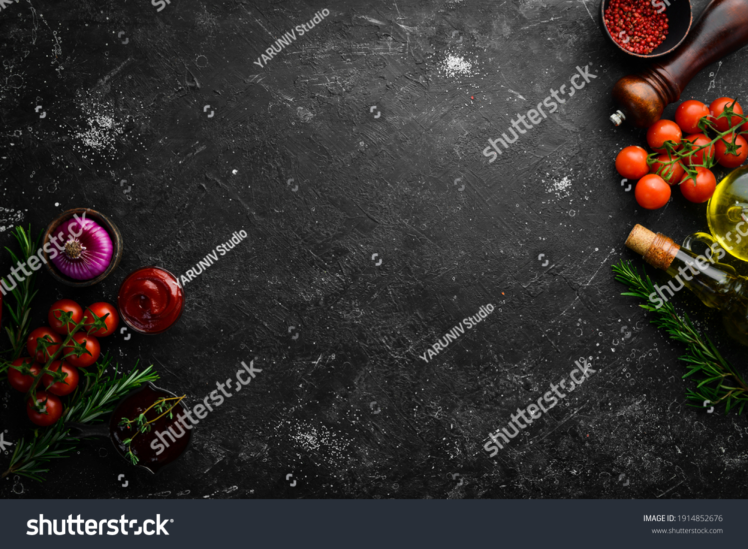 Black stone cooking background. Spices and vegetables. Top view. Free space for your text. #1914852676