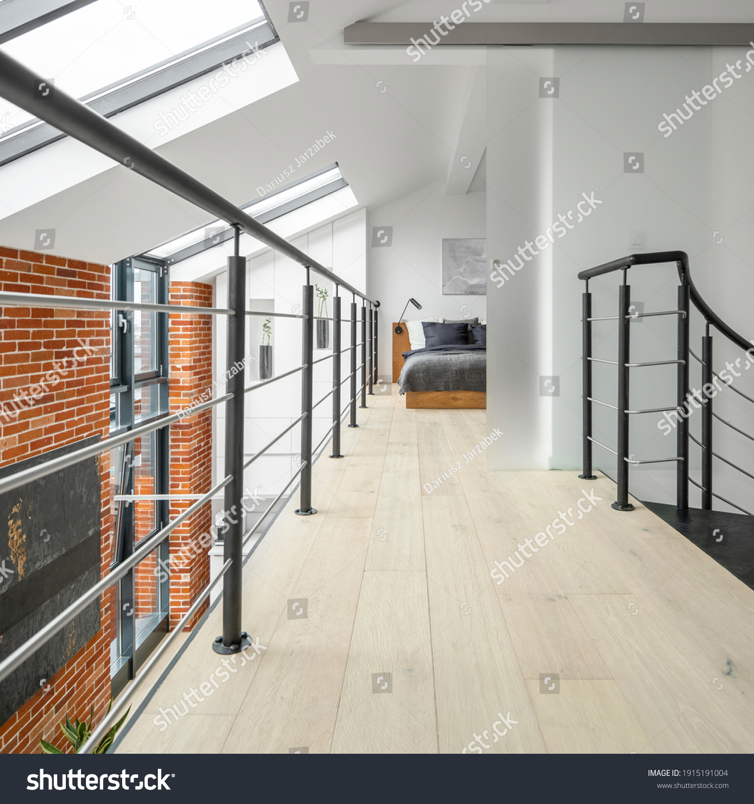 Bright corridor on second floor in loft apartment, with railing, brick wall, big windows and bedroom at the end #1915191004