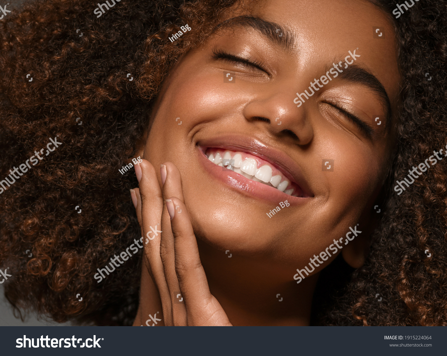 Beautiful african american woman face close up  teeth smile happy positive #1915224064