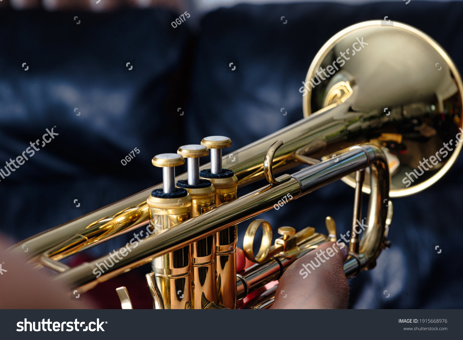 Trumpet. Close up of a trumpet, blurred background   #1915668976