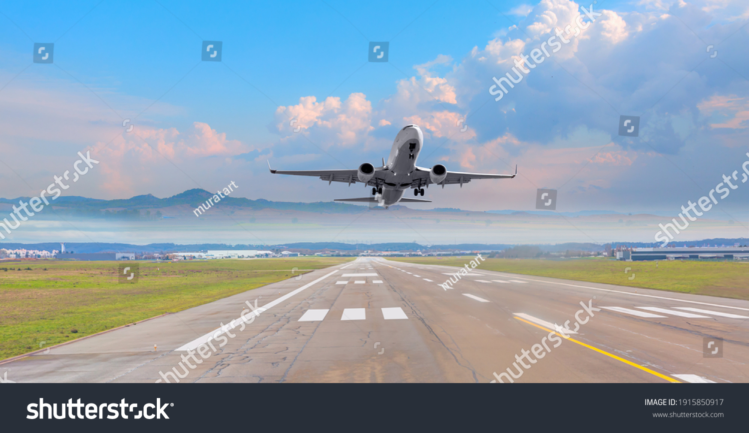 White Passenger plane fly up over take-off runway from airport  #1915850917