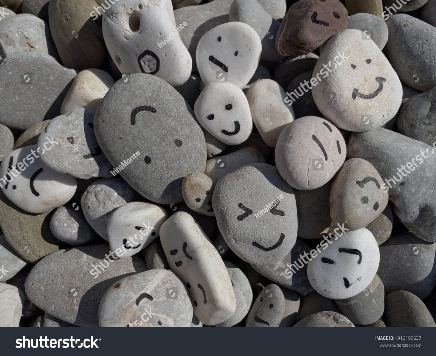 Emotion management concept, stones with painted faces symbolize different emotions. We are all different, but all together, learning to manage emotions #1916199637