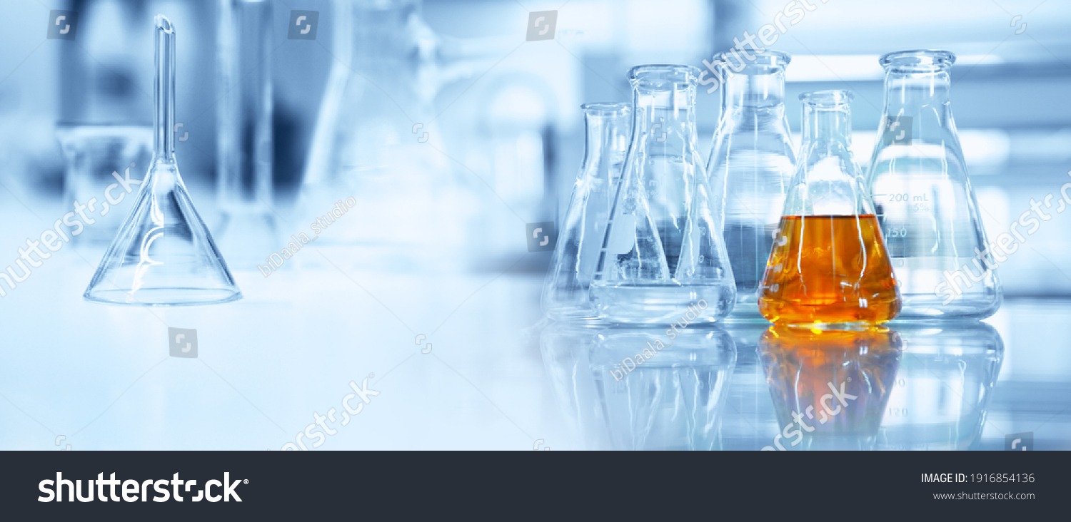 flask and glassware equipment in chemistry science laboratory blue banner background	 #1916854136