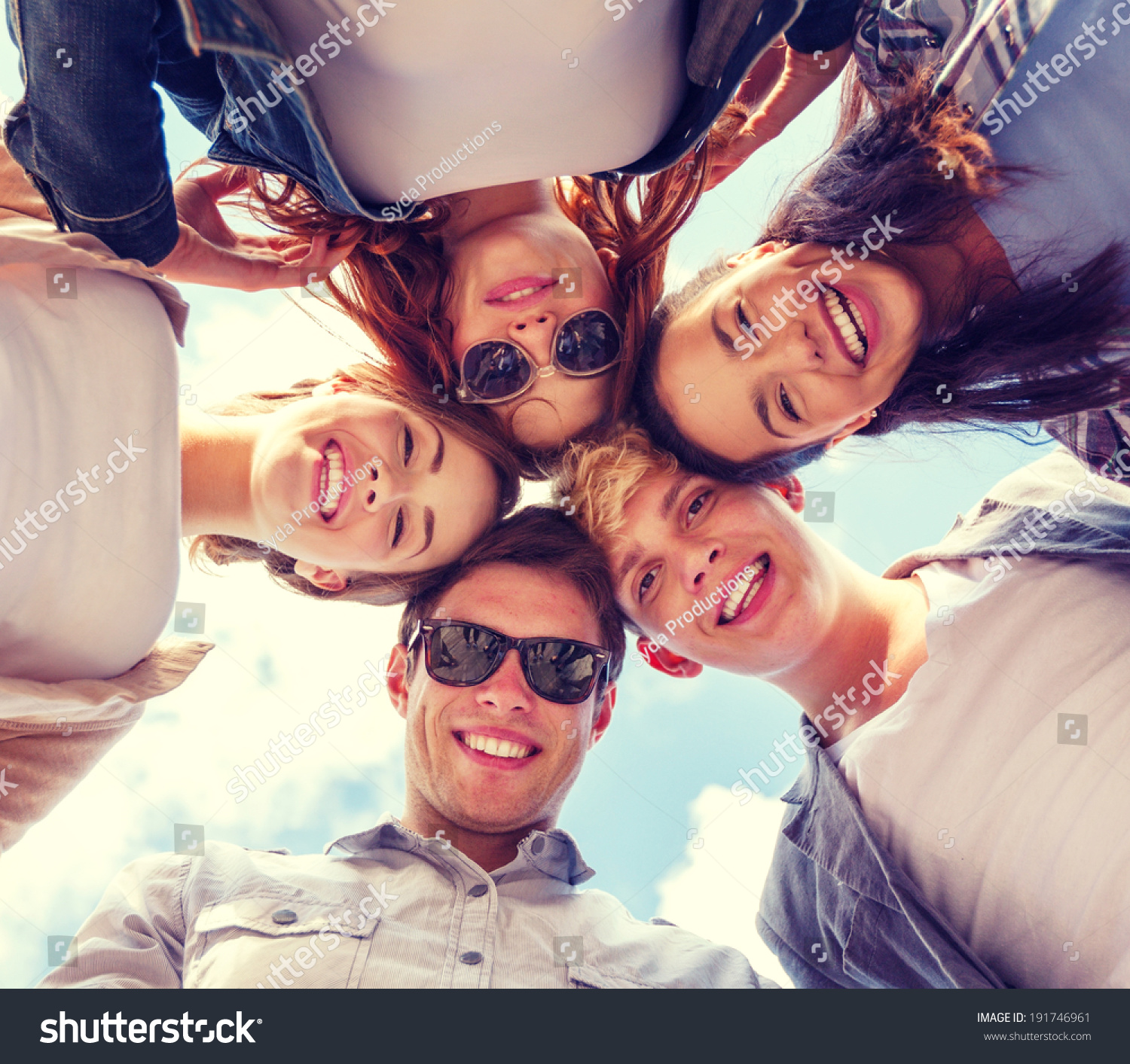summer holidays and teenage concept - group of teenagers looking down #191746961