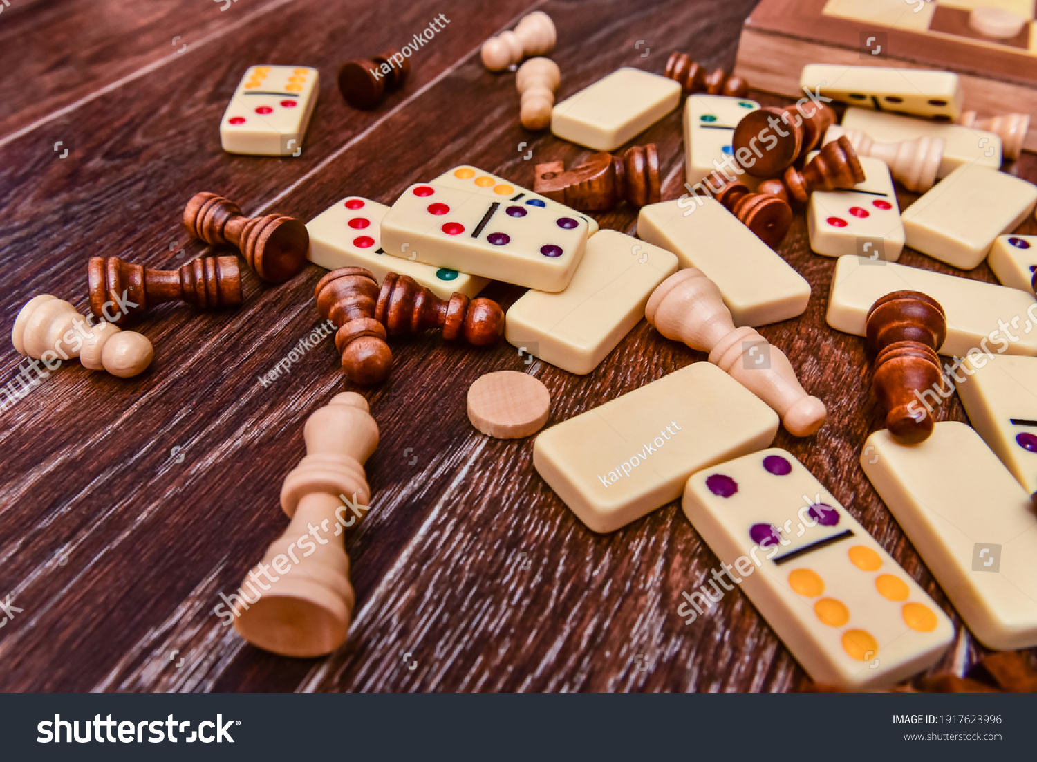 A variety of board game pieces. A background miscellaneous board game pieces. #1917623996
