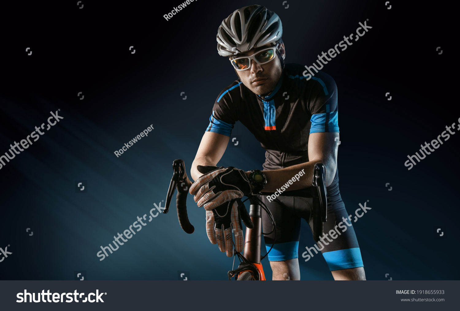 Spost background with copyspace. Cyclist. Dramatic colorful close-up portrait. #1918655933