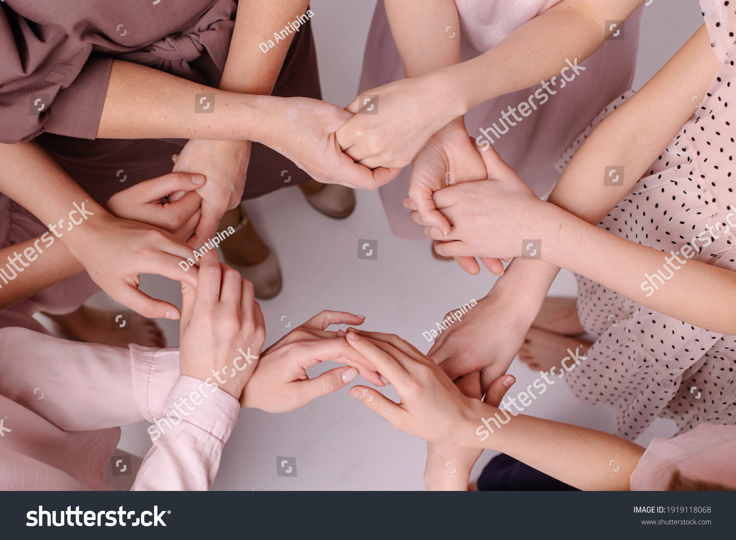 circle from female hands. Feminism nursing support concept. Together women help each other. Gently touch. Carefully. Partnership friends. Tactility. Offline communication togetherness. Gentle tones #1919118068