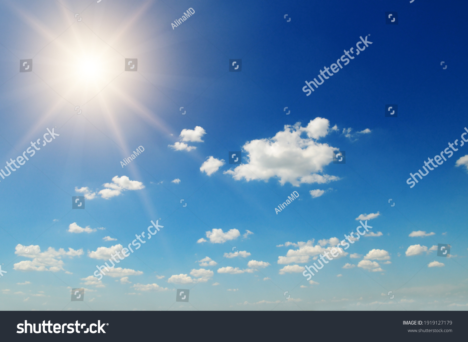 Strong sun, blue sky and cumulus clouds. #1919127179