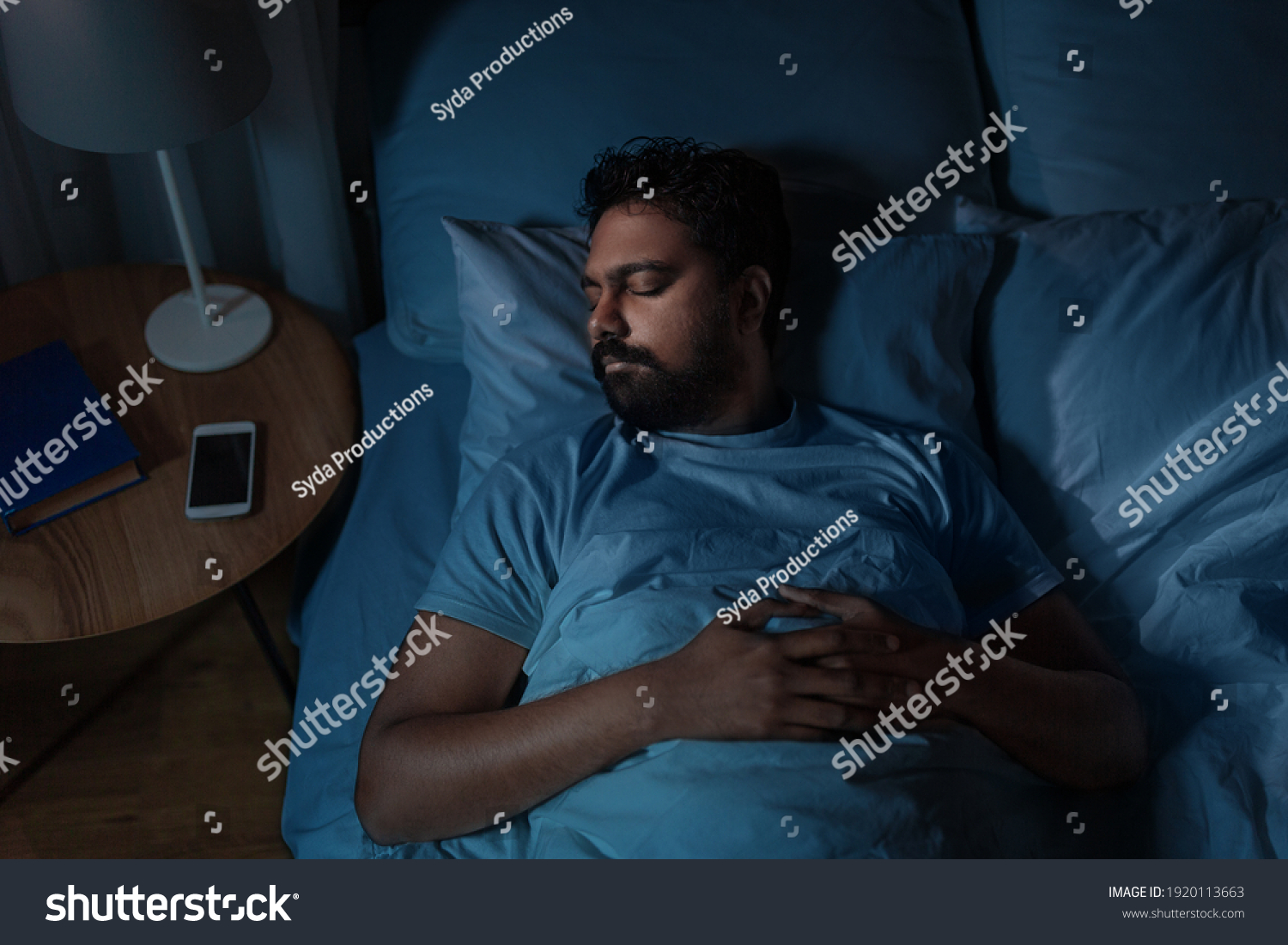 people, bedtime and rest concept - indian man sleeping in bed at home at night #1920113663