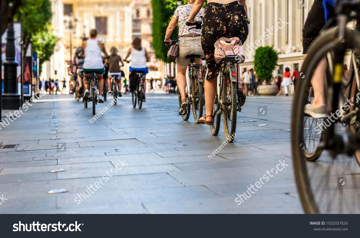 Many people in the city center in the pedestrian zone
who walk on foot and by bicycle #1920337826