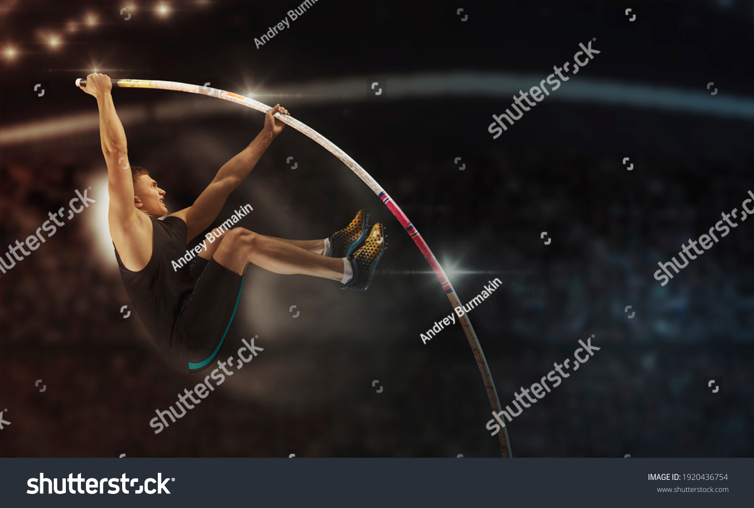 Professional pole vaulter training at the stadium in the evening. Sports banner. Horizontal copy space background #1920436754