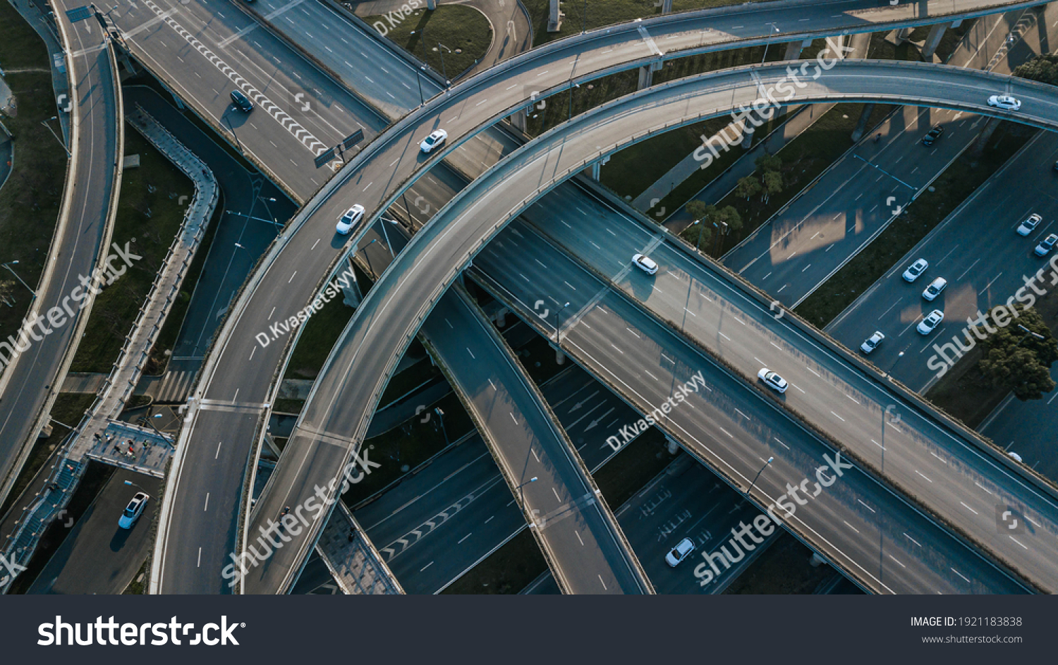Top up aerial drone view of elevated road and traffic junctions in Chinese metropolis city Chengdu during sunny day. Modern construction design of traffic ways to avoid traffic jams. Few vehicles. #1921183838