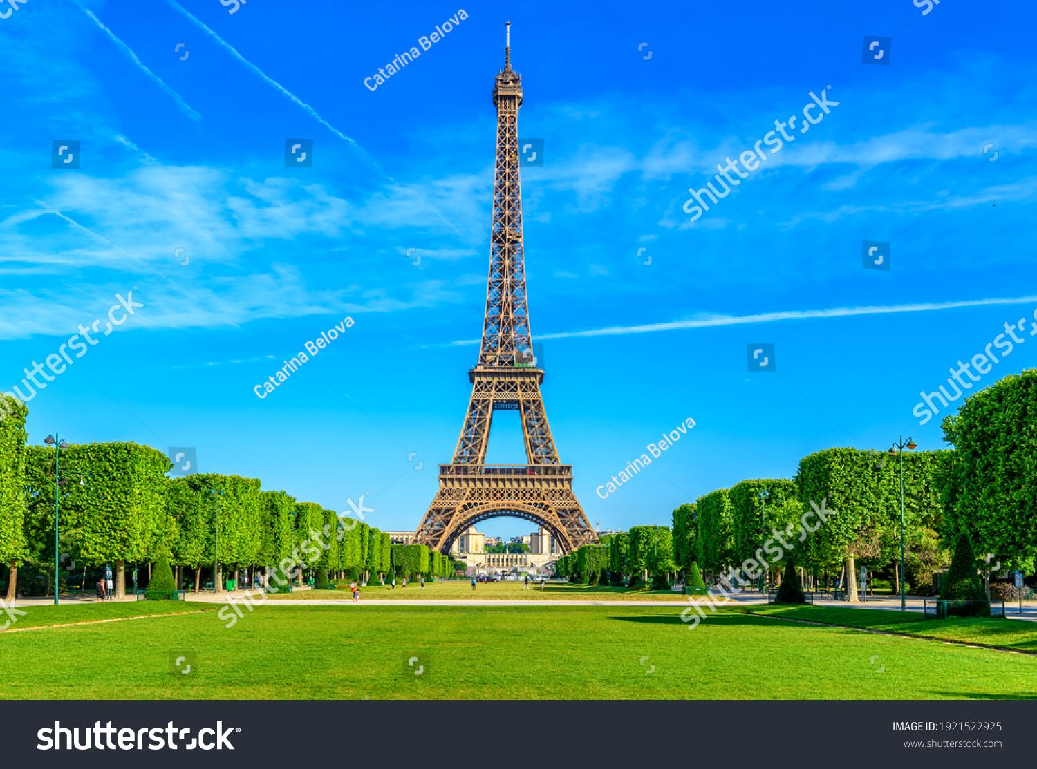 Paris Eiffel Tower and Champ de Mars in Paris, France. Eiffel Tower is one of the most iconic landmarks in Paris. The Champ de Mars is a large public park in Paris #1921522925