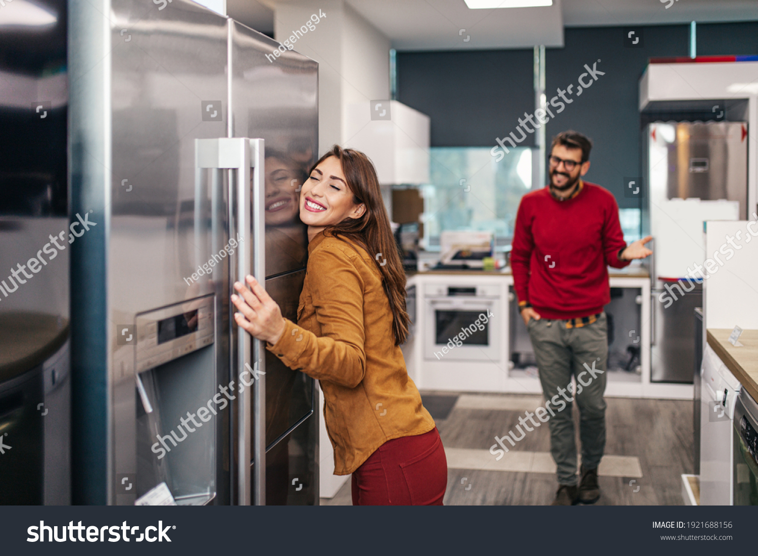Young couple, satisfied customers choosing fridges in appliances store. #1921688156