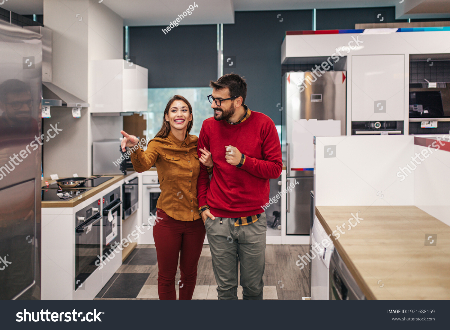 Young couple, satisfied customers choosing fridges in appliances store. #1921688159