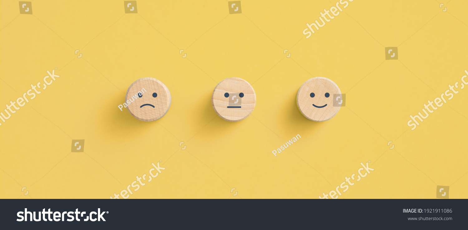 Wooden blocks with the happy face smile face symbol on yellow background, evaluation, Increase rating, Customer experience, satisfaction and best excellent services rating concept #1921911086