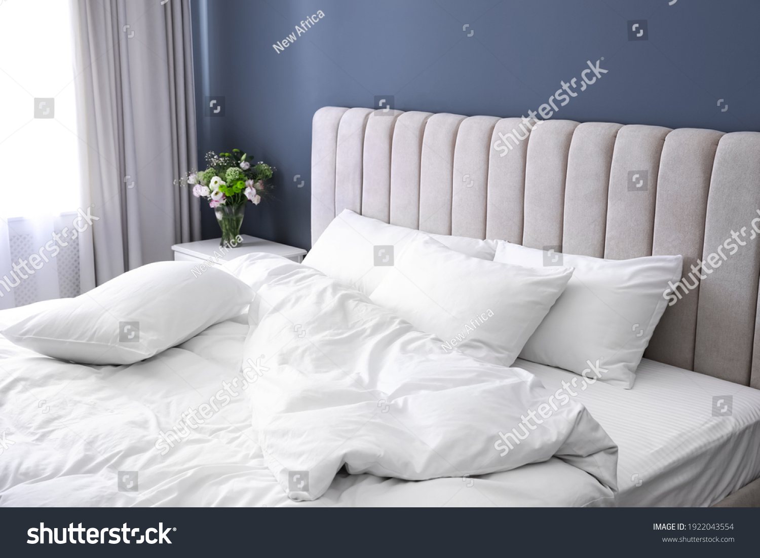 White soft pillows on comfortable bed indoors #1922043554