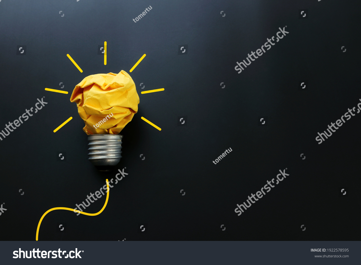 Education concept image. Creative idea and innovation. Crumpled paper as light bulb metaphor over black background #1922578595