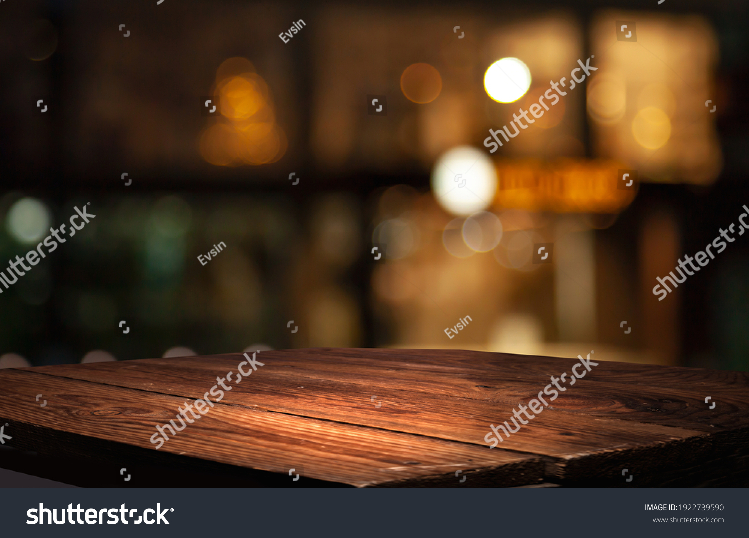 empty table to showcase your product, against the background of a blurred cafe golden bokeh #1922739590