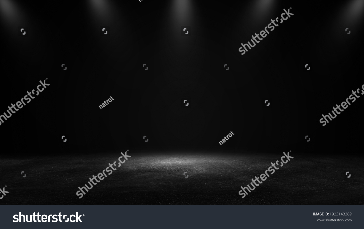Product showcase with spotlight. Black studio room background. Use as montage for product display #1923143369