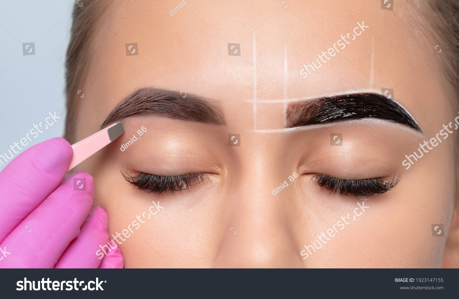 Make-up artist makes markings with white pencil for eyebrow and paints eyebrows. Professional makeup and facial care. #1923147155