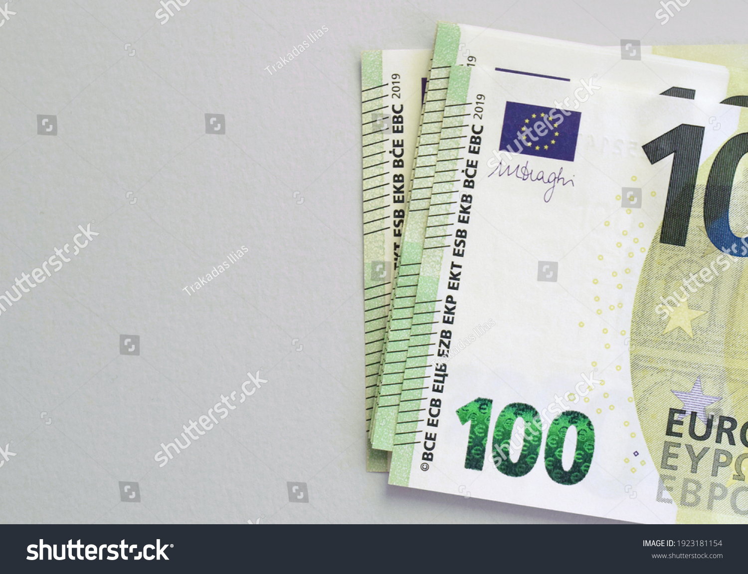 100 euro banknotes on grey background. European currency #1923181154
