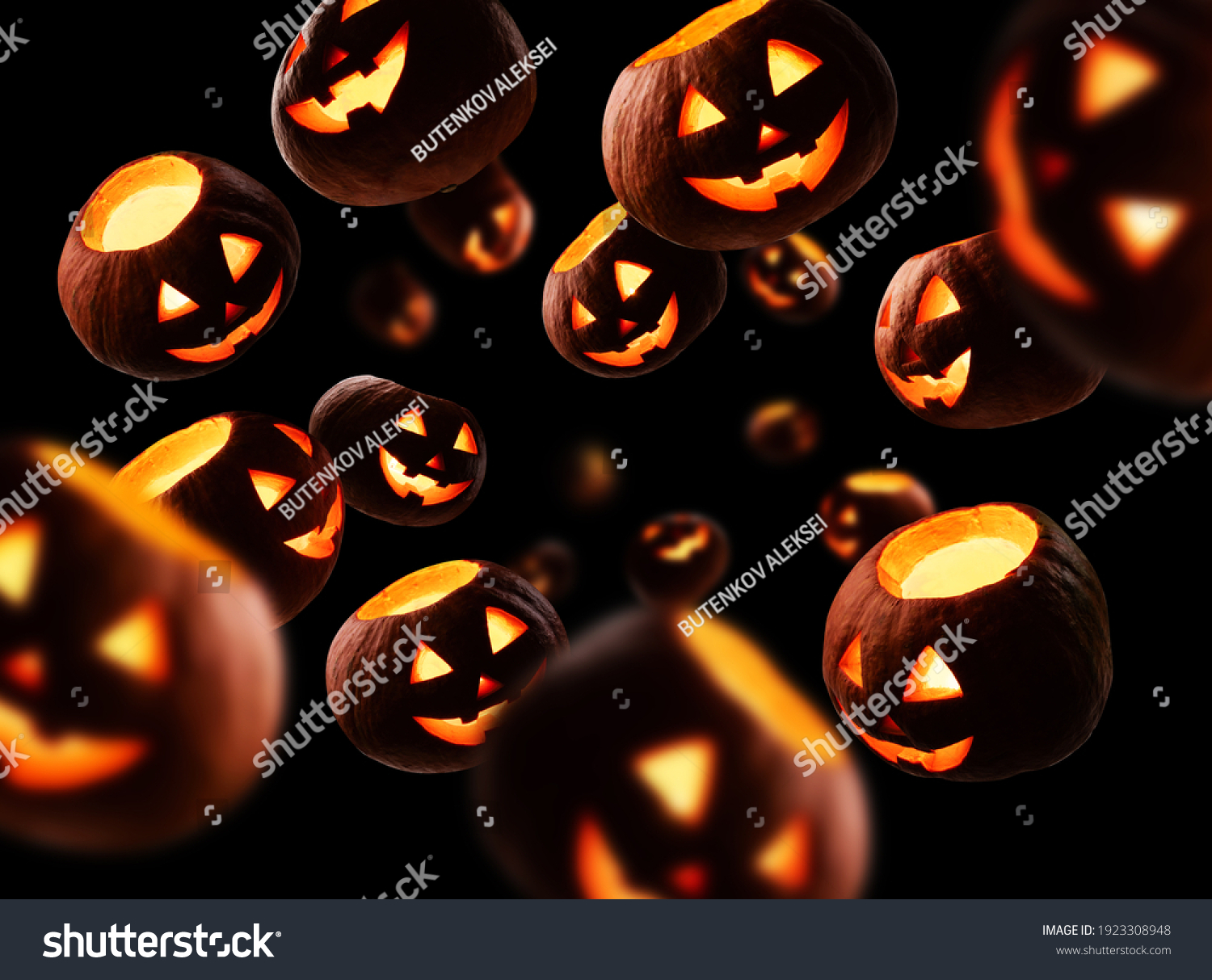 Glowing pumpkins levitate on a black background #1923308948