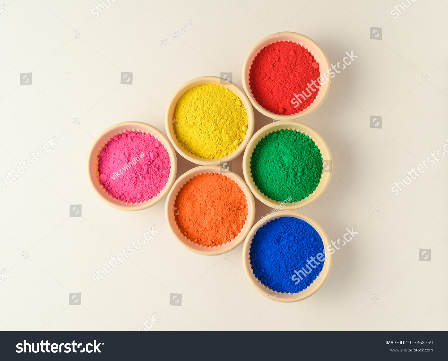 top view of colorful traditional holi powder in bowls isolated on white background.Space for text . happy holi.Concept Indian color festival called Holi #1923368759