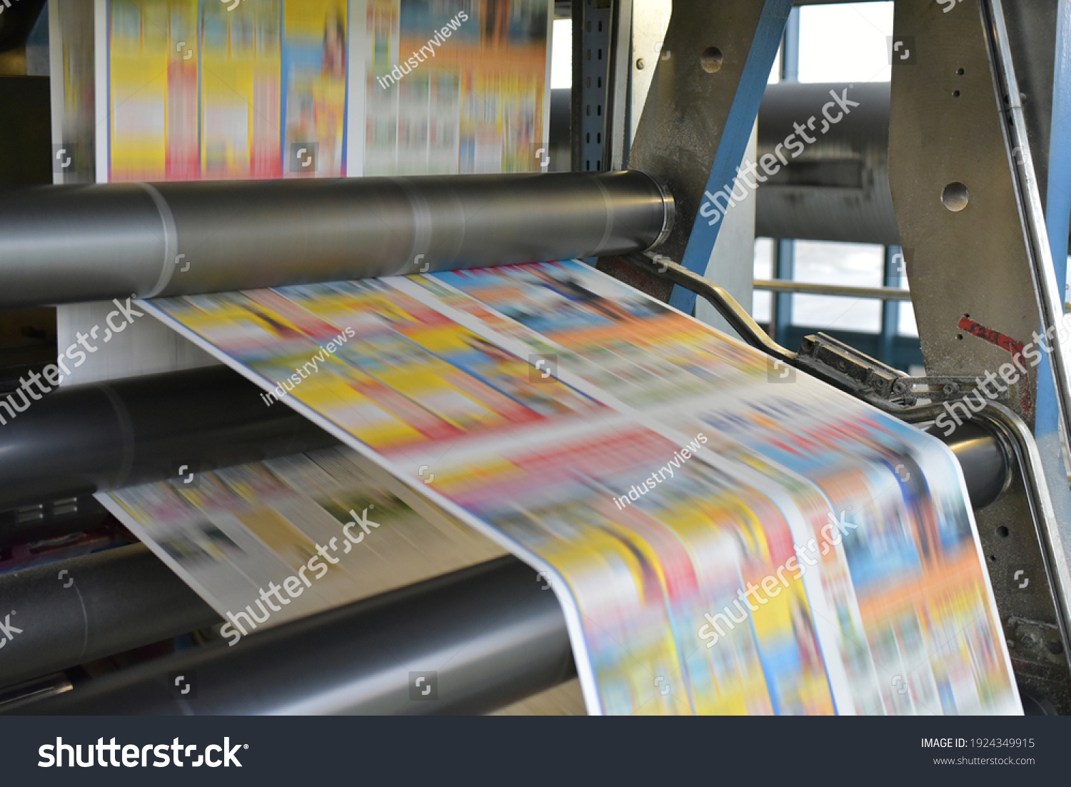 paper rolls and offset printing machines in a large print shop for production of newspapers and magazines #1924349915