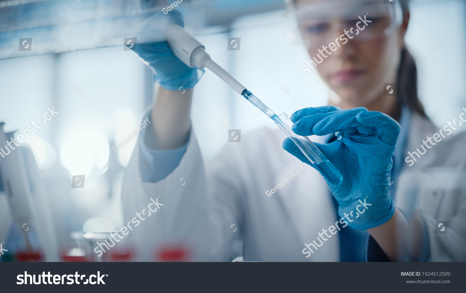 Medical Research Laboratory: Portrait of a Beautiful Female Scientist Using Micro Pipette for Analysis. Advanced Scientific Lab for Medicine, Biotechnology, Microbiology Development. Hands Close-up #1924512509