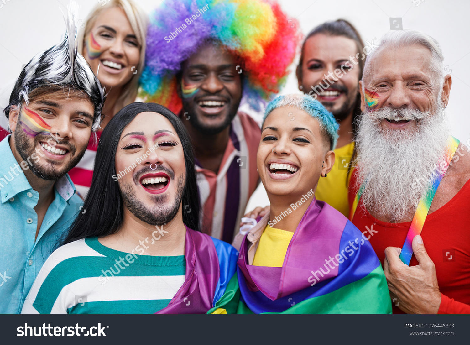Multiracial gay people having fun at pride parade - Concept of lgbt and homosexual or transexual love #1926446303