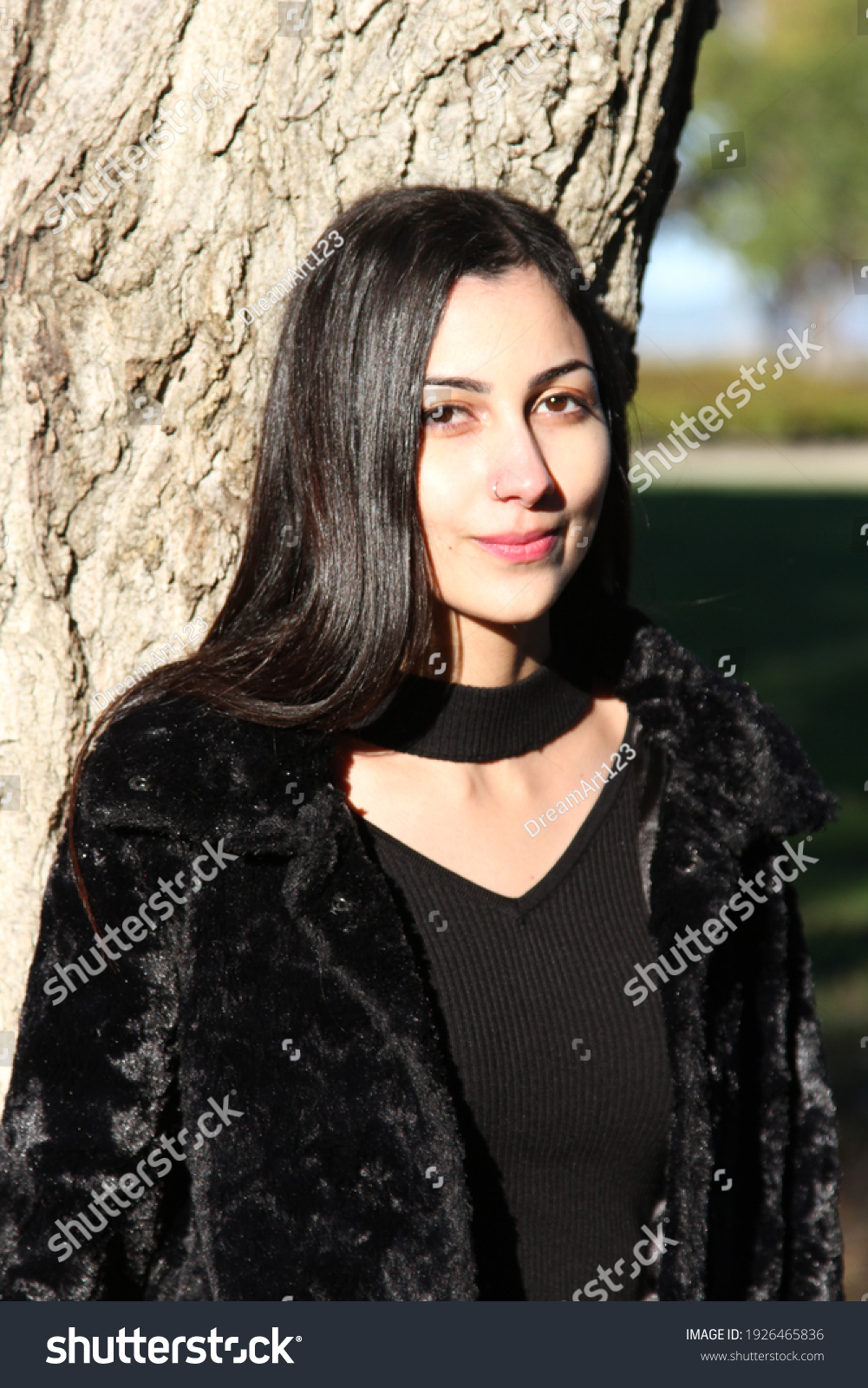 Middle Eastern girl in a park #1926465836