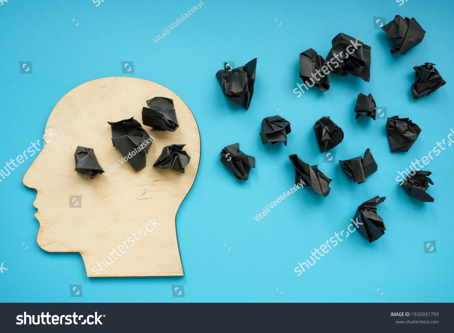Head shape with black paper balls as symbol of depression and negative thoughts. #1926931793