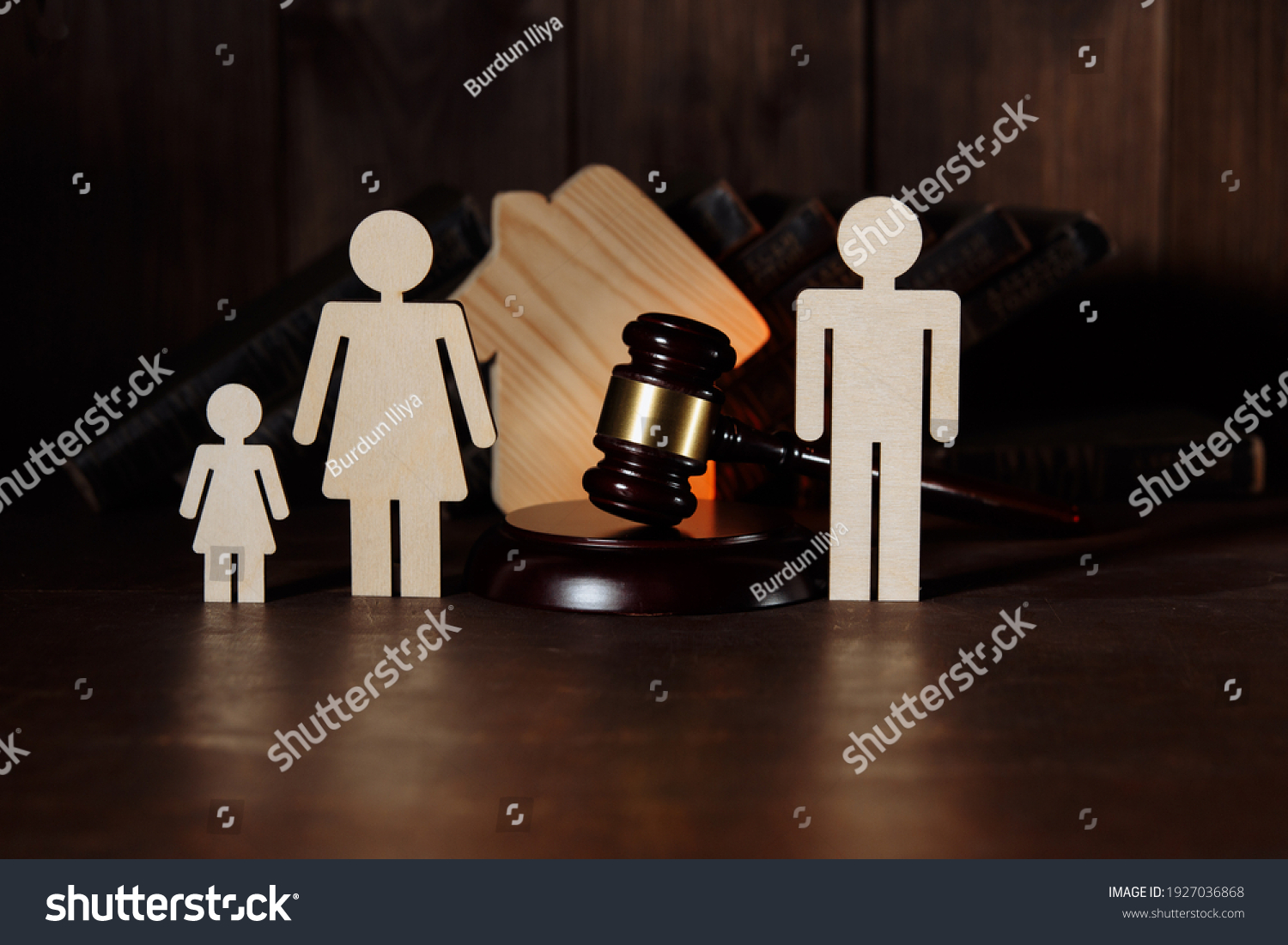 Judge gavel between split family figures #1927036868