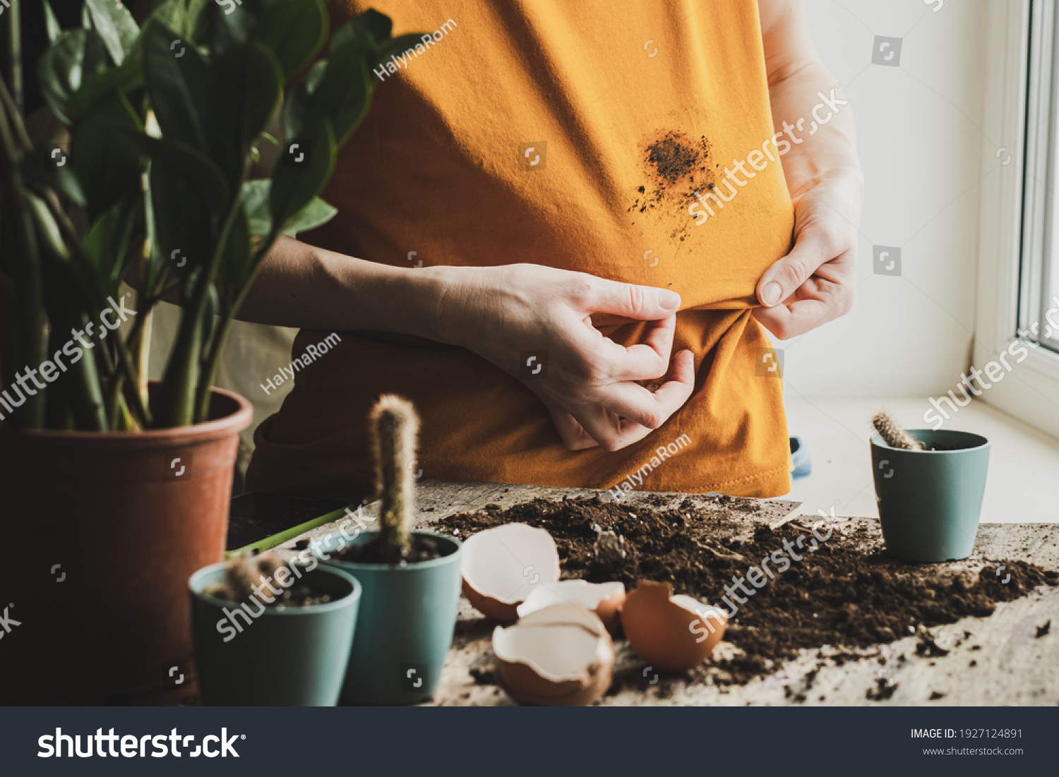 Girl hand showing dirty stain on cloth for cleaning and washing. dirt stains in daily life concept. High quality photo #1927124891