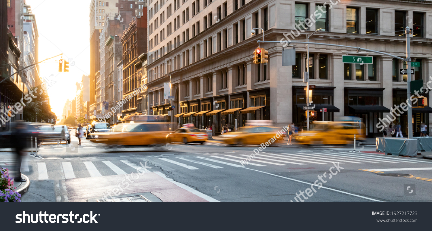 Yellow taxis driving through the busy intersection of 5th Avenue and 23rd Street in Manhattan, New York City USA #1927217723