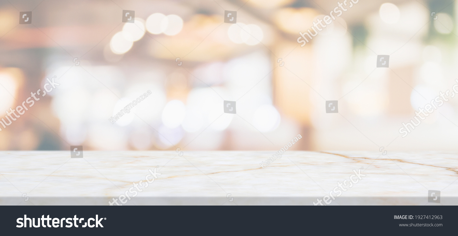 marble table top with blurred abstract cafe restaurant interior background #1927412963