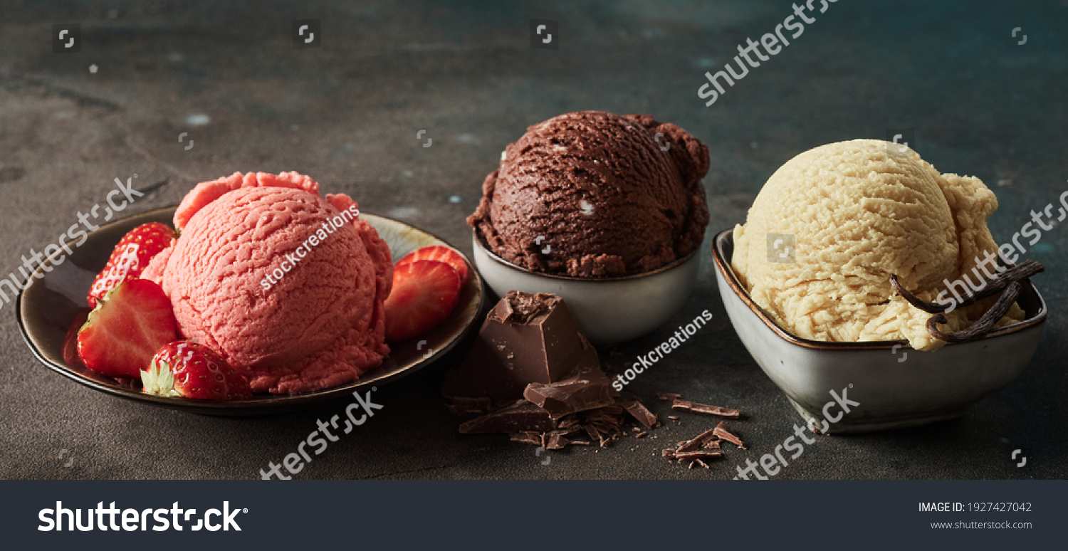 Wide angle of collection of delicious gelati with fresh strawberries and grated chocolate with aromatic vanilla pod #1927427042