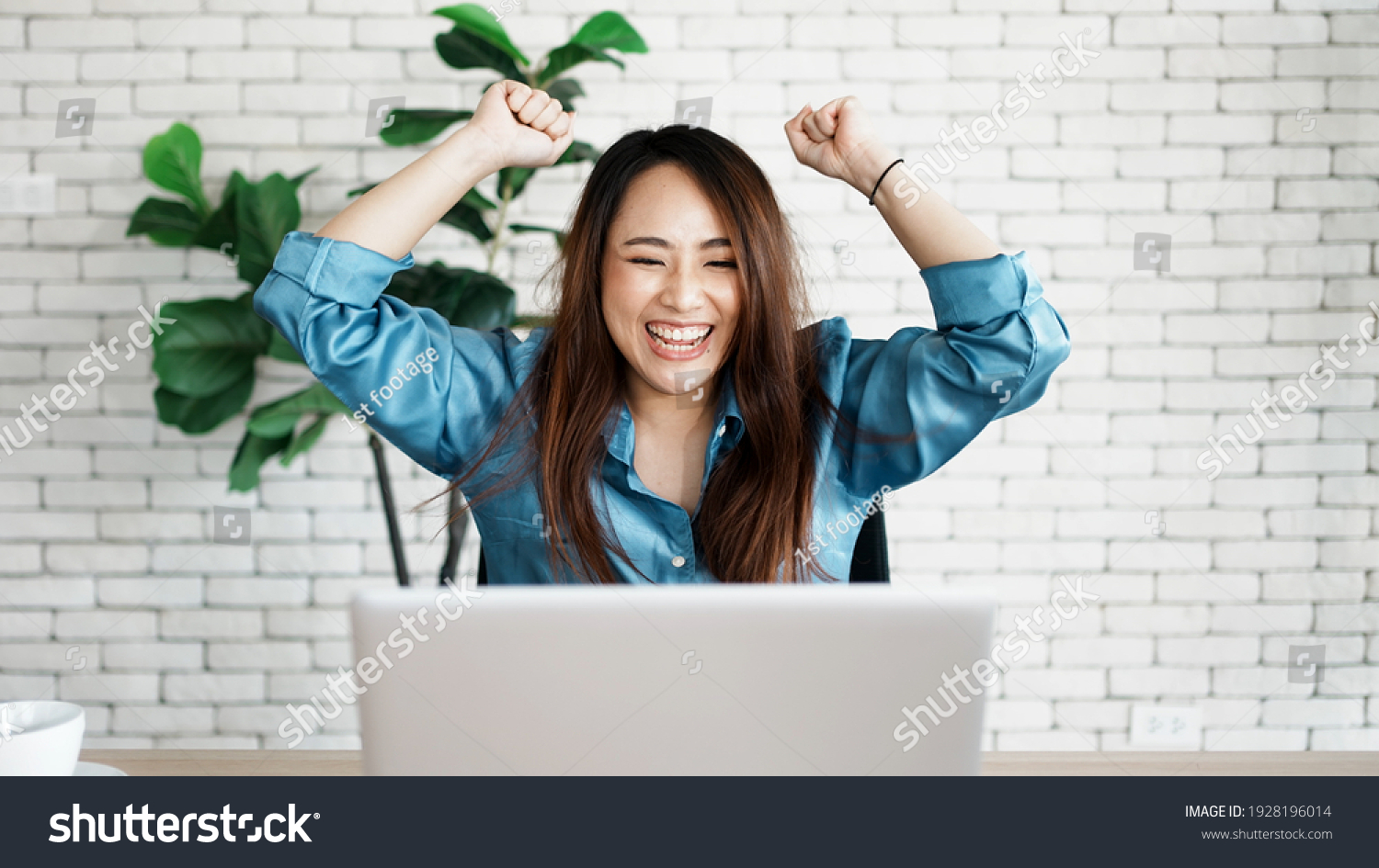 Portrait of success businesswoman enjoy success with laptop on work desk. Authentic shot joyful woman got jackpot, Surprised and celebrating her victory. #1928196014