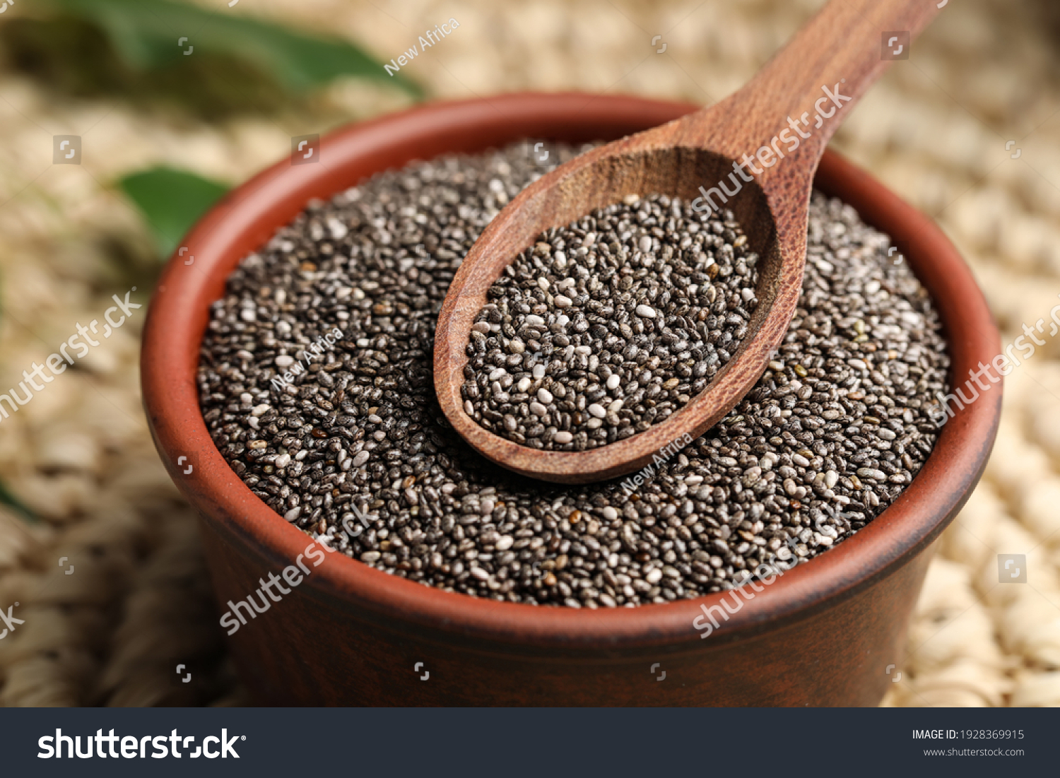 Bowl and spoon with chia seeds, closeup #1928369915
