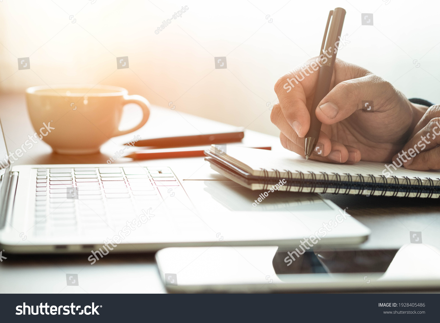 man hand using writing pen memo on notebook paper or letter, diary on table desk office. Workplace for student, writer with copy space. business working and learning education concept. #1928405486