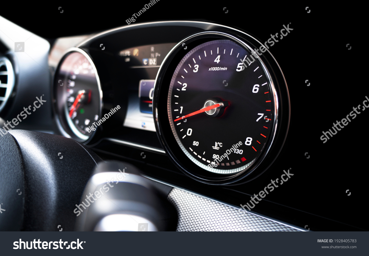 Close up shot of a speedometer in a car. Car dashboard. Dashboard details with indication lamps. Car instrument panel. Dashboard with speedometer, tachometer, odometer. Car detailing. #1928405783