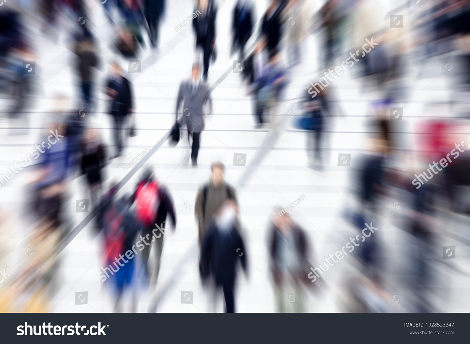 Blurred group of people walking during rush hour #1928523347