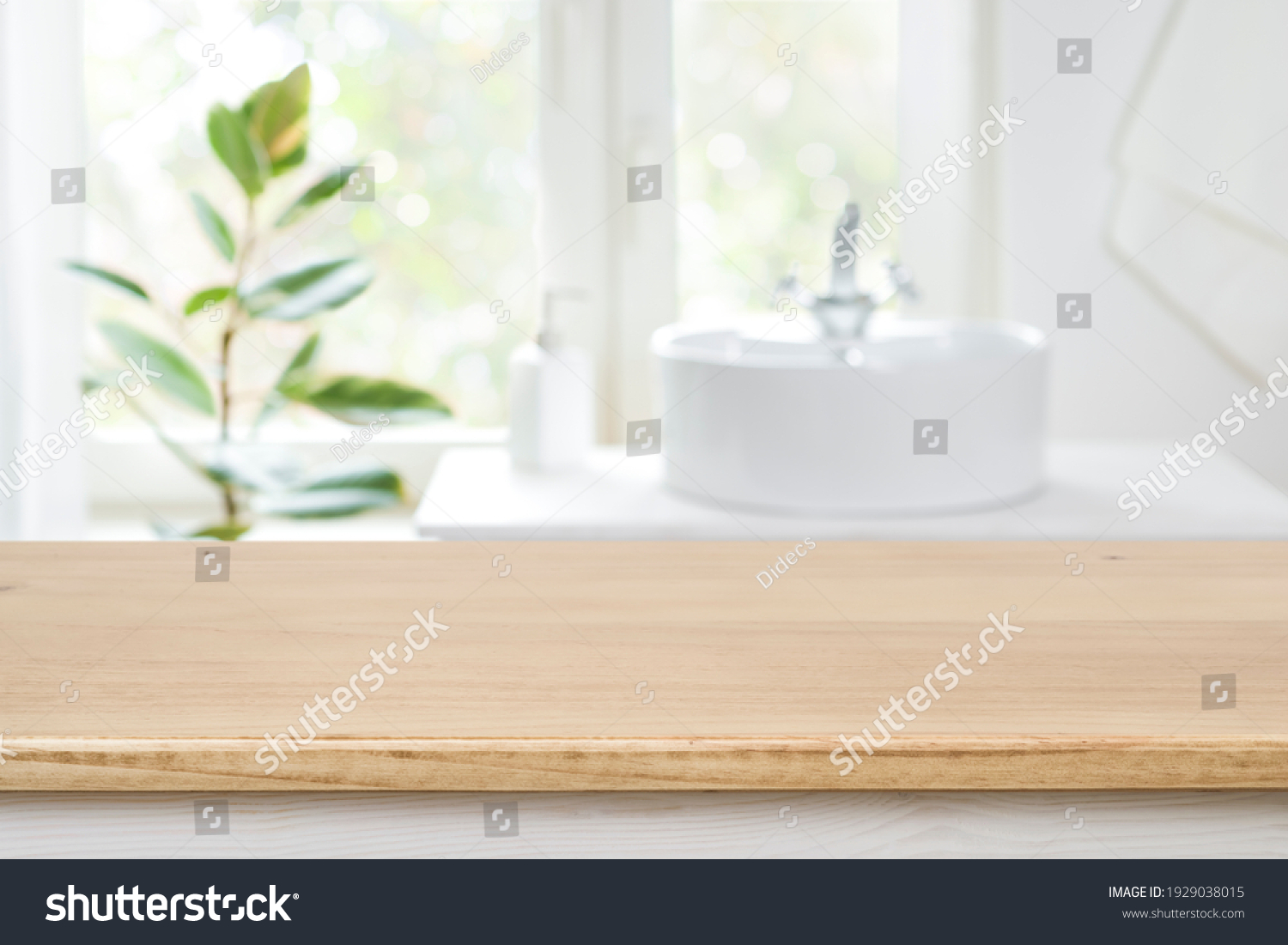 Bathroom sink near window with wooden table in front focus #1929038015
